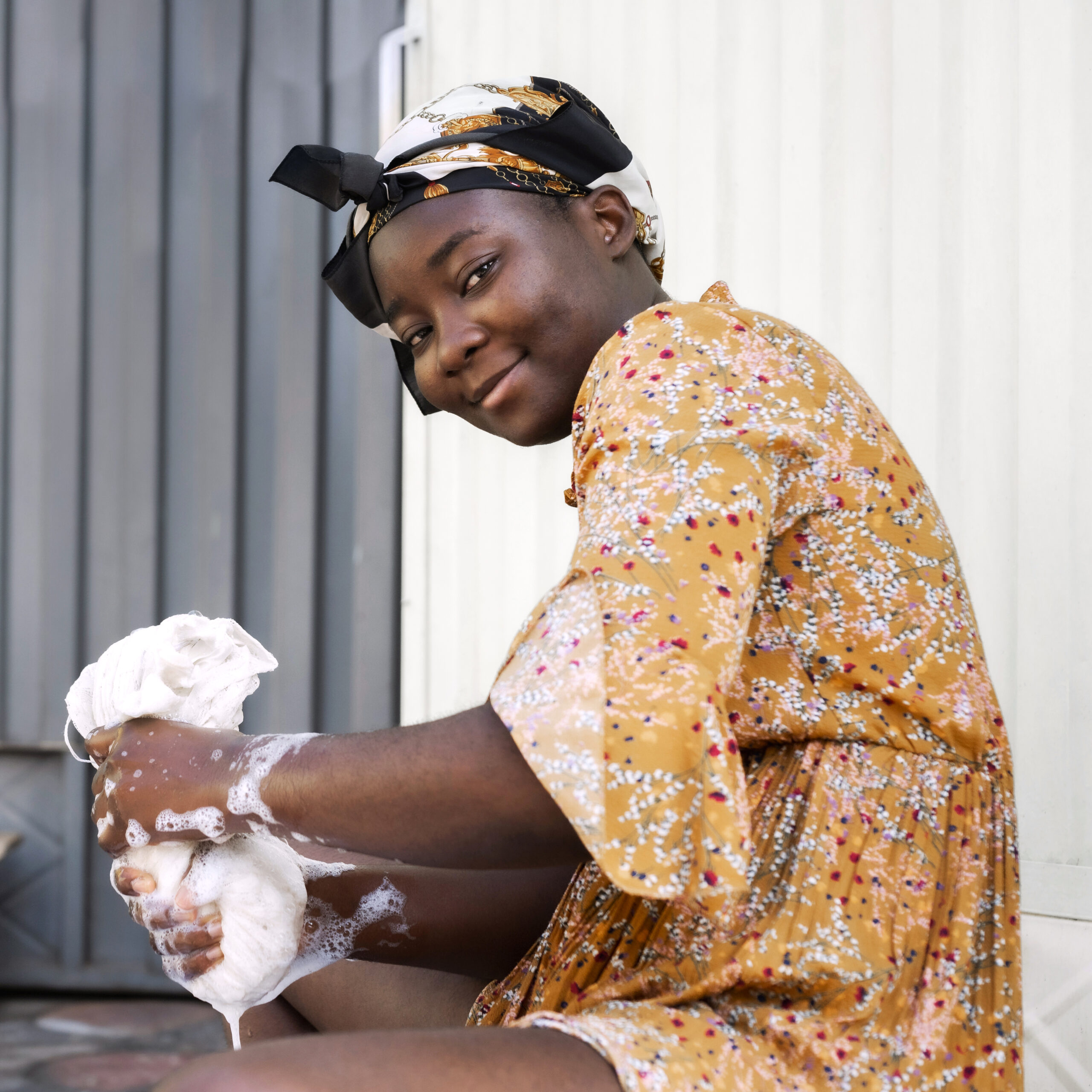 medium shot woman washing clothes